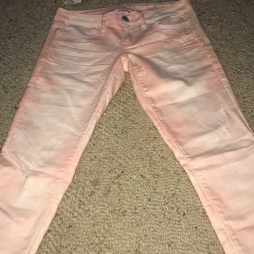 slightly destressed pink low rise jeans